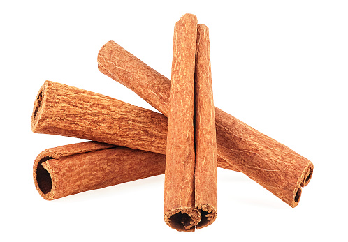 Group of cinnamon sticks isolated on a white background. Cassia rolls.