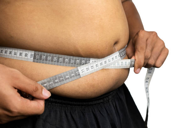 istock fat man measuring his body 2026578502