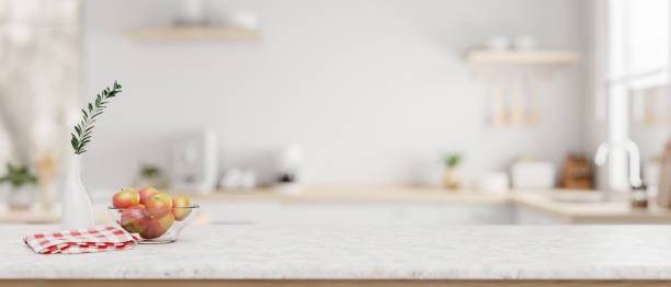 istock A white marble kitchen countertop with empty space for product display in a modern white kitchen. 2026601760