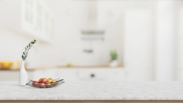 istock A close-up shot of a white marble kitchen tabletop with empty space in a modern white kitchen. 2026602804