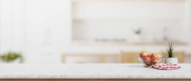 istock A white marble kitchen countertop with empty space for product display in a modern white kitchen. 2026607540