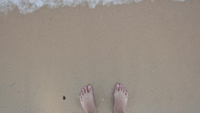 slow motion scene, close up barefoot on sand beach of summer sea trip travel