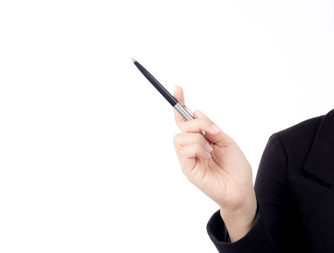 Close-up hand of young asian woman holding a black pen, set against isolated white background with copyspace, close-up of hand businesswoman holding pen on white, business concept.