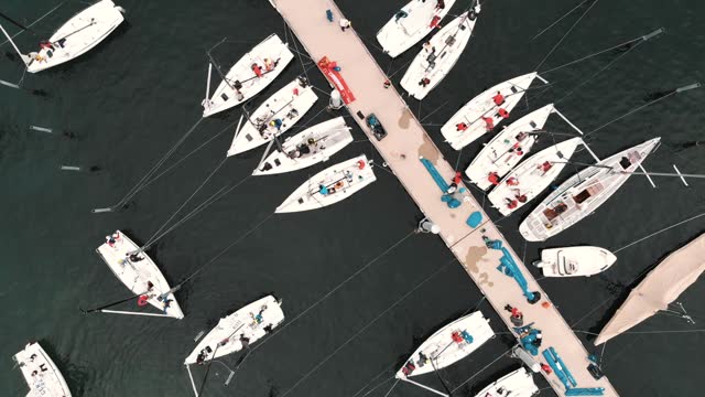 Sailboats are moored at the dock in Lindau in this twisting high-angle shot