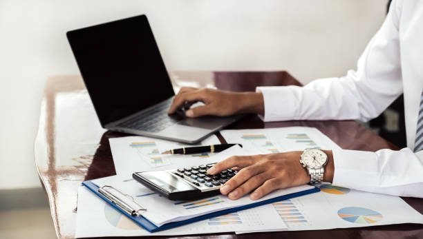istock Businessmen bookkeeper hand use calculator and laptop analysis the graph for Setting challenging business goals and ready to achieve target at home office 2026695278