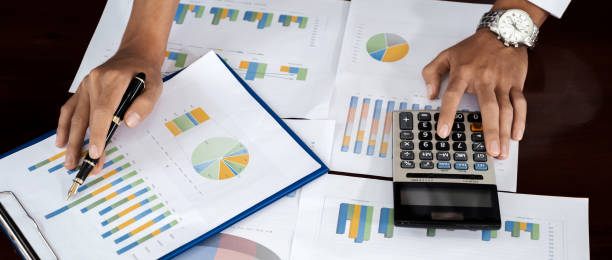 istock Businessmen bookkeeper hand holding pen use calculator analysis the graph for Setting challenging business goals and ready to achieve target at home office 2026695279