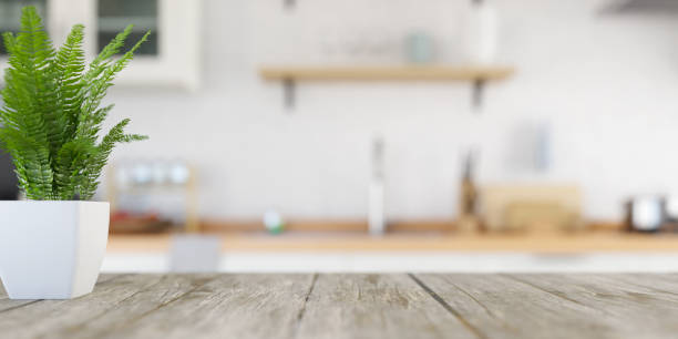 istock White kitchen interior background with focus on kitchen wooden table and blurred background. 3d rendering 2026745621