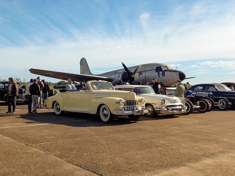 Morón, Argentina - May 27, 2023: Old cream 1946 Ford Lincoln convertible coupe V12 at a classic car show in an airfield. Copy space