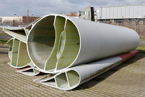 Cross-section of a severed rotor blade of a wind turbine in a storage yard