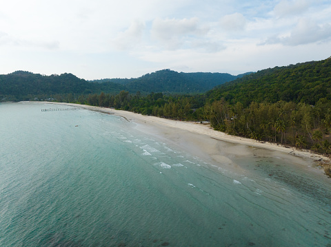 Aerial drone view of beautiful beach with turquoise sea water and palm trees of Gulf of Thailand. Kood island, Thailand.