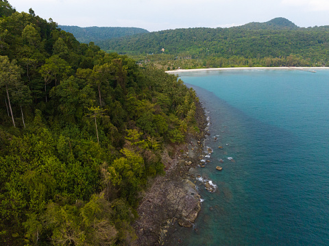 Aerial drone view of beautiful beach with turquoise sea water and palm trees of Gulf of Thailand. Kood island, Thailand.