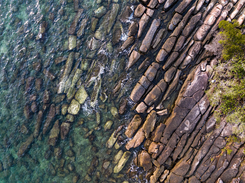 Aerial drone view of beautiful rocky with turquoise sea water of Gulf of Thailand. Kood island, Thailand.