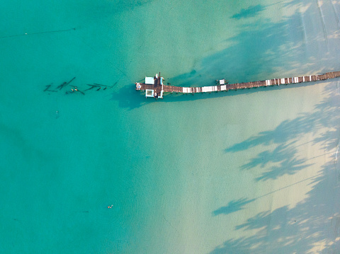 Aerial drone view of beautiful beach with turquoise sea water of Gulf of Thailand. Kood island, Thailand.