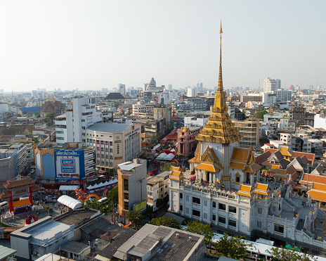 An aerial view of the Traimit Withayaram temple and Chinatown gate, The most famous tourist attraction in Bangkok, Thailand.