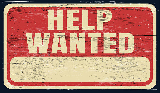 Vintage distressed help wanted sign on wood