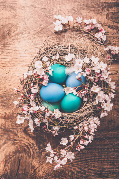 istock Easter background with colorful eggs in nest on  wooden background 2026927945