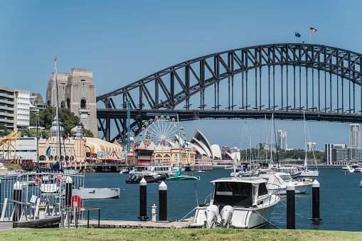 Sydney, NSW, Australia, February 17th 2024. Moored boats with Sydney Harbour Bridge, Luna Park, and Sydney Opera House in the background.