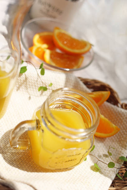 Orange juice poured into a mason jar