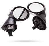 Close-up on a pair of side mirrors from a minibus with turn signal repeaters for repair and replacement after an accident in a workshop. Auto service industry. Spare parts catalog.