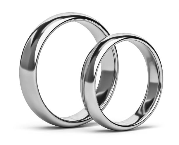istock Two wedding silver rings isolated on white. Unity, love concept 2027009747
