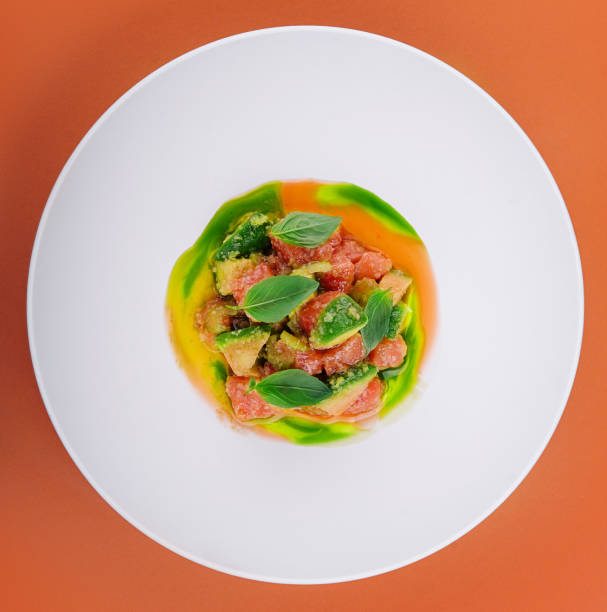 istock salmon with avocado and basil on white plate 2027010787