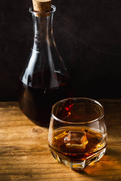 istock whiskey on wooden background 2027013443