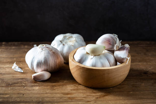 istock garlic on wooden background 2027013958