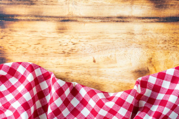 istock red table cloth on wooden background 2027017207