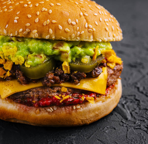 istock veggie burger with guacamole and pickles on toasted bun 2027024111