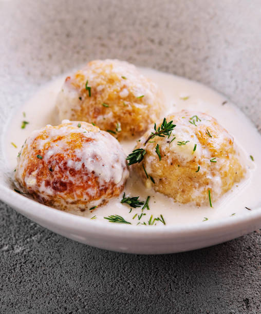 istock Creamy sauce fried meatballs on plate 2027038545