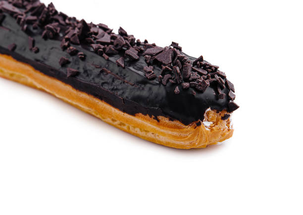 istock delicious chocolate French eclair on white 2027055549