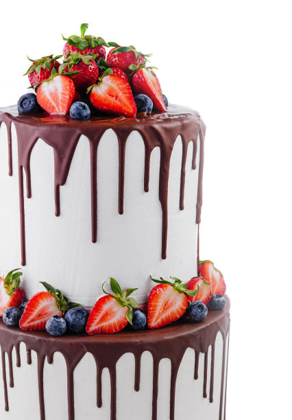istock White cake with melted dark chocolate with fresh berries 2027067155