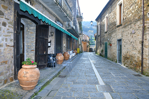A narrow street among the old houses of a village in the province of Salerno.