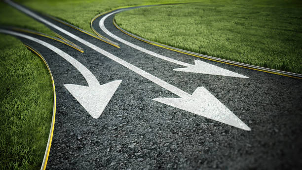 istock Three arrow signs on asphalt road pointing different ways. Choice and decisions concept 2027106814