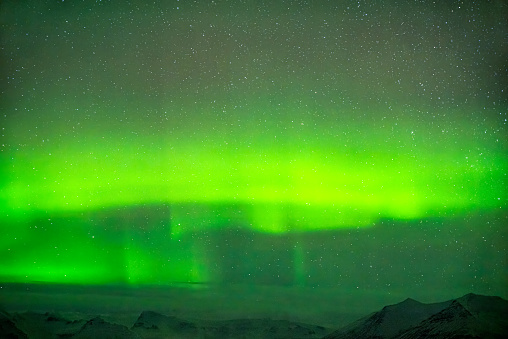 Panoramic view of the northern lights in the sky, captured in Iceland in 2024