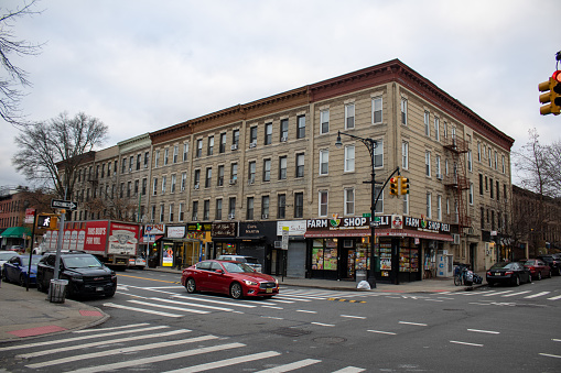 nyc, United States – February 01, 2024: A spacious building adjacent to a parking lot at a bustling intersection
