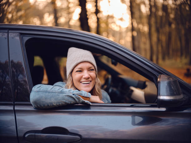 istock Happy woman enjoying in a car. 2027118517