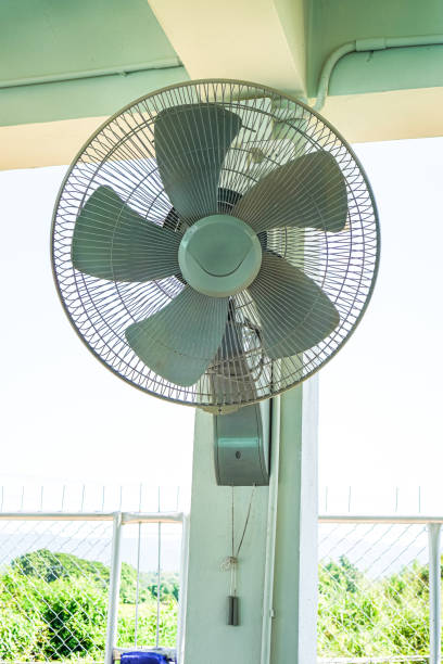 Wall mounted fan on garage wall