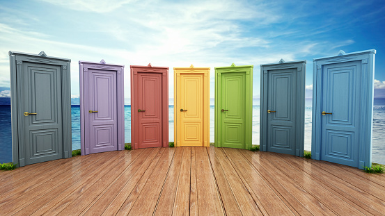 Vibrant colored closed wooden doors in a row on blue sky and sea background. Choice and decisions concept.