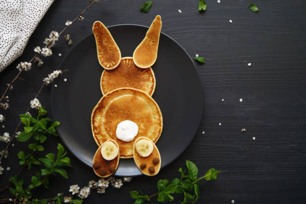 Easter pancake bunny Easter pancake bunny on the black background bunny pancake stock pictures, royalty-free photos & images