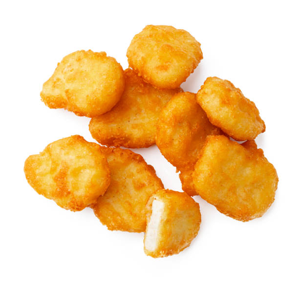 istock Pile of fried chicken nuggets isolated on white 2027155636