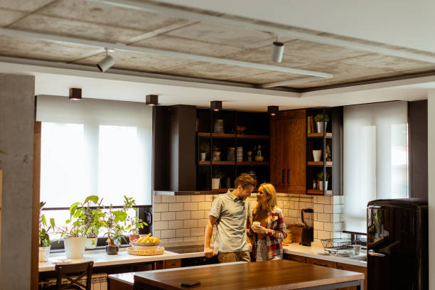istock Embraced in Warmth: A Couples Tender Moment in a Cozy Kitchen at Dusk 2027159016