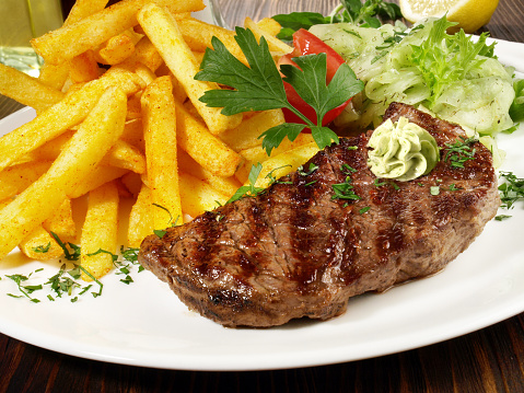 Grilled Beef Steak with French Fries; Meat specialty and popular fine food