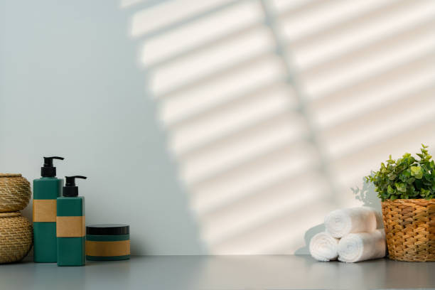istock Soap dispenser and spa towels on white background in shadow 2027214946