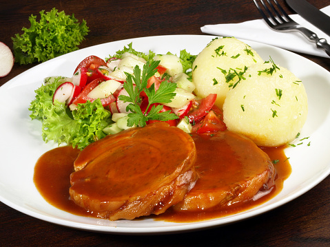 Rolled Pork Roast with Potato Dumpling and Salad; Meat specialty and popular fine food