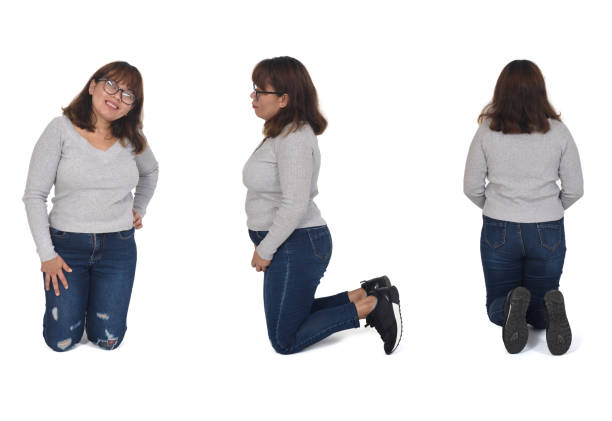 istock view of the same woman kneeling on white background 2027235656