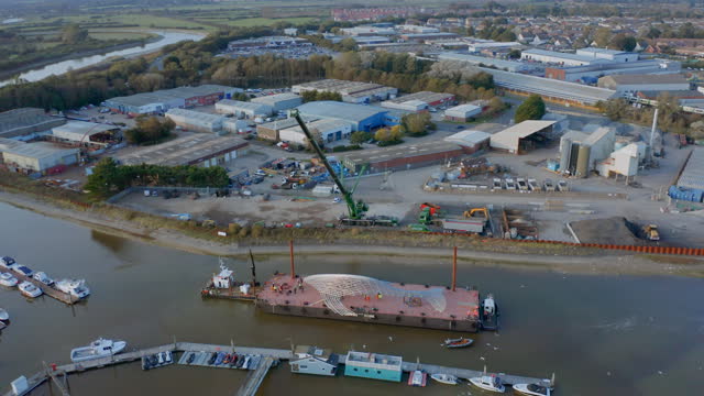 Aerial drone footage capturing the scenic beauty of Littlehampton Harbour, showcasing maritime activities, docked boats, and picturesque coastal landscapes