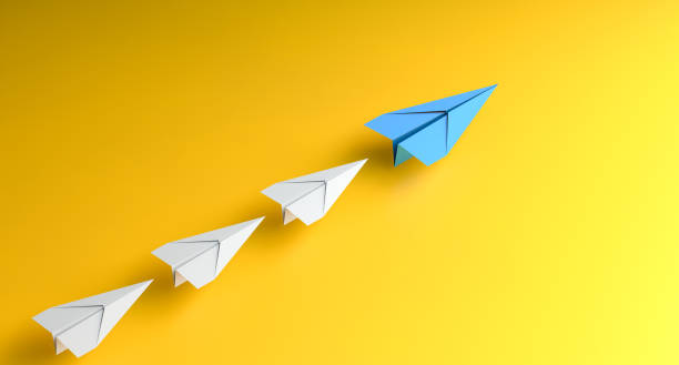 istock Leadership concept, blue leader plane leading white planes, on yellow background 2027242611