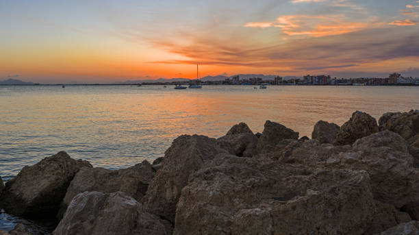 istock sunset at sea with omega sun and reflection in the water 2027254106