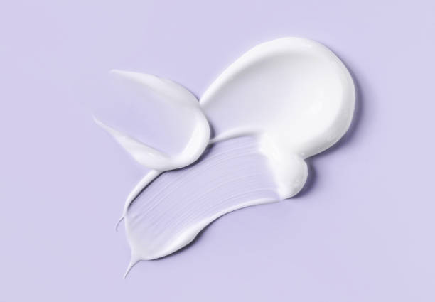 istock cosmetic smears cream texture on pastel background 2027282111